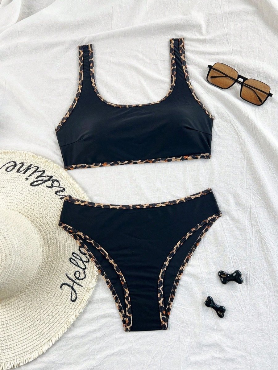 Lifestyle shot of the leopard print two-piece swimsuit showcasing adjustable straps and ruffled edges.