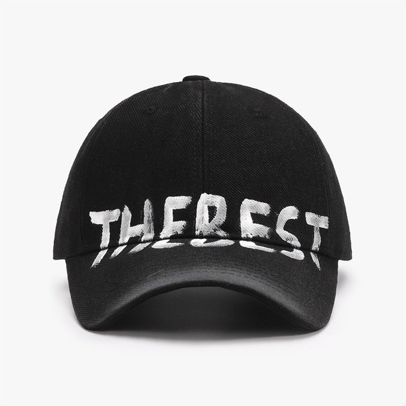 Front view of a black adjustable cotton blend cap featuring graffiti design, chic and stylish.