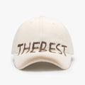 Front view of a cream adjustable cotton blend cap with graffiti design, versatile for minimalist outfits.