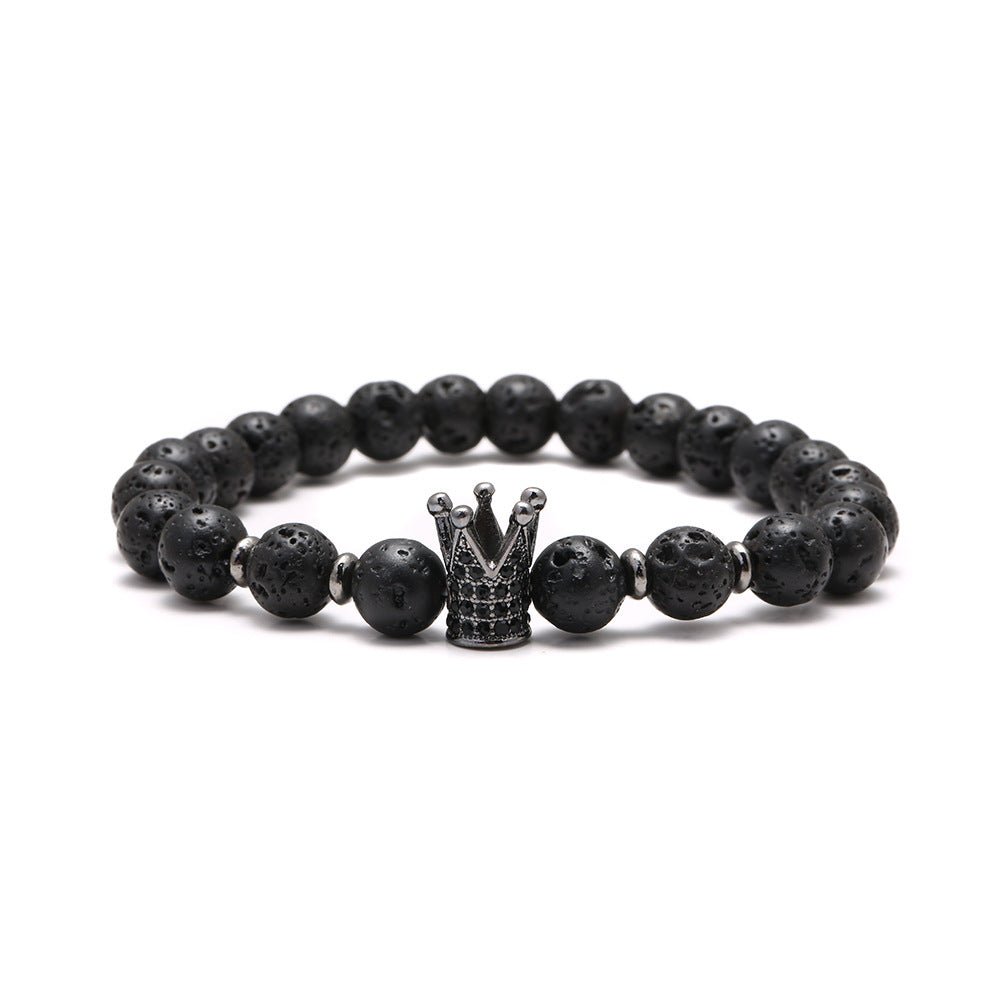Detail close-up of the black stone bracelet with a lion charm, versatile for various occasions.