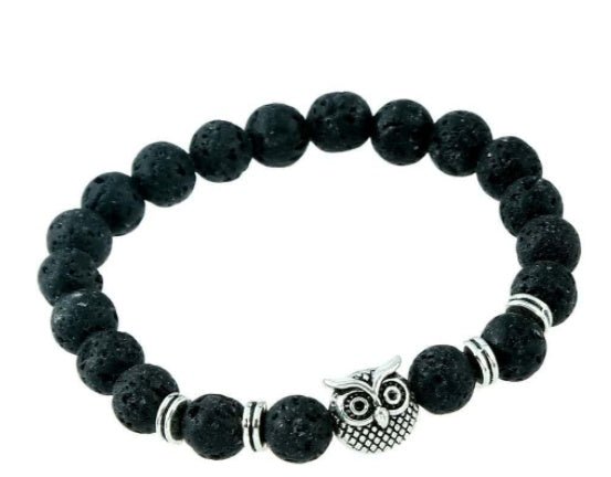 Detail close-up of the black stone bracelet showcasing a lion charm, perfect for bold fashion statements.