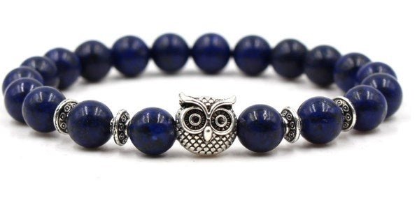 Detail close-up of the blue stone bracelet showcasing a lion charm, ideal for a minimalist look.