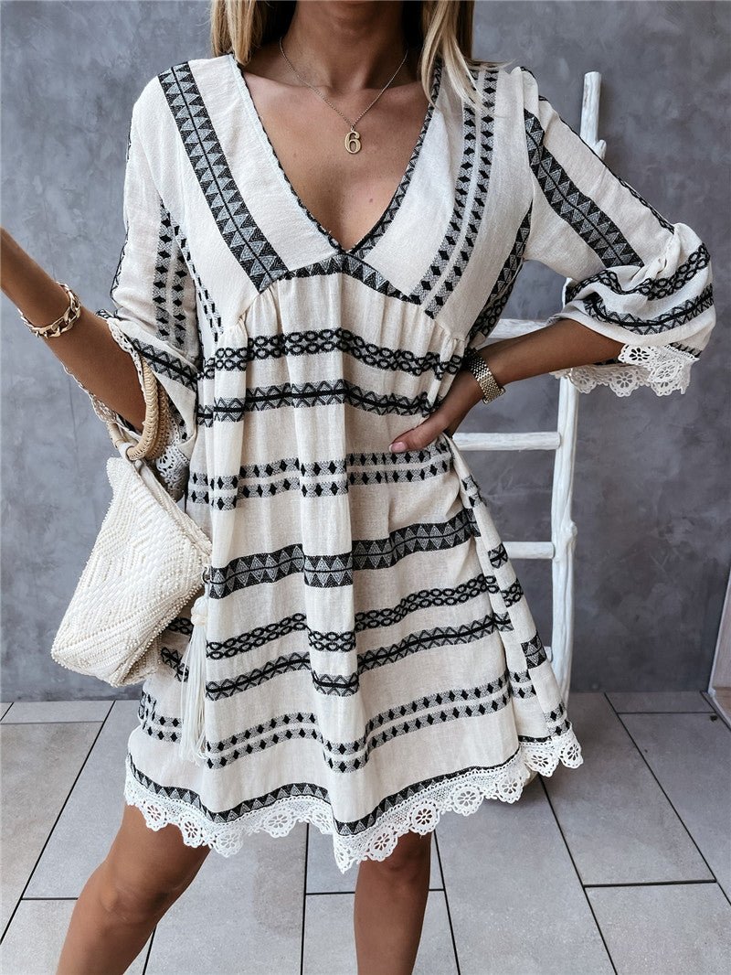 Long sleeve black and white geometric print dress, lifestyle shot showcasing relaxed fit and v-neck.