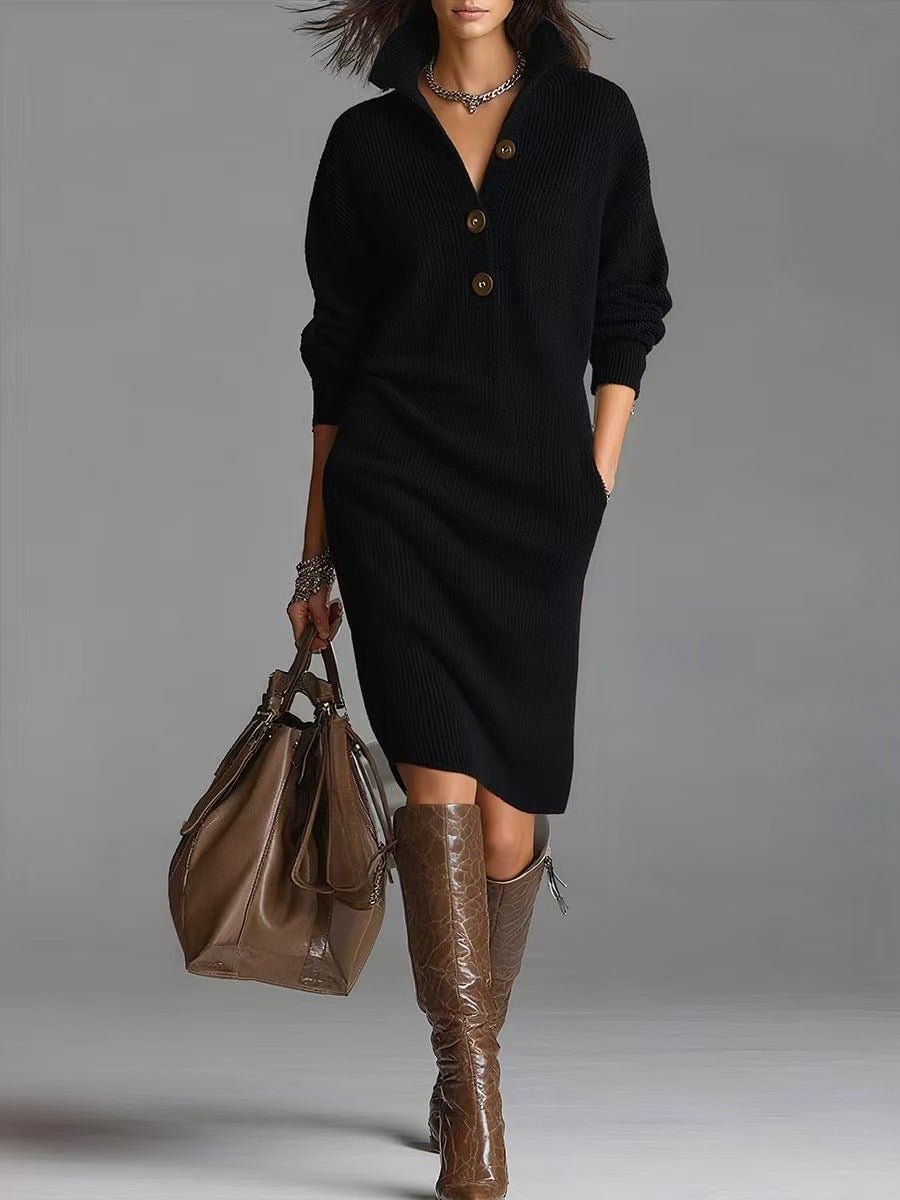 Long black pullover sweater dress with button detail, elegant minimalist style in studio setting.
