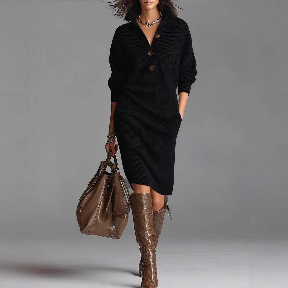 Long black pullover sweater dress showcasing button detail, sophisticated minimalist style in studio environment.