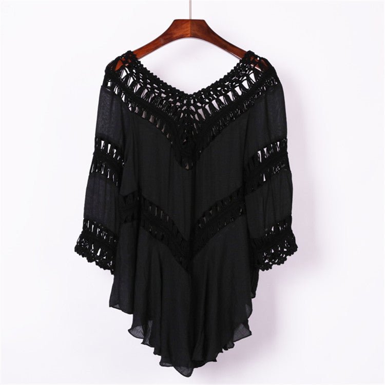 Front view of black crochet cover-up with v-neck and lace details, elegant addition to any wardrobe.