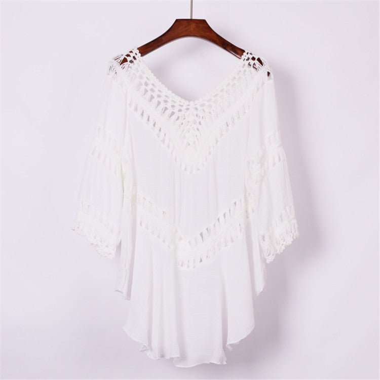 Front view of white crochet cover-up with open front and flowy design, perfect for beach outings.
