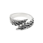 Close-up detail of the silver couple ring featuring the angel wings design on a neutral background.
