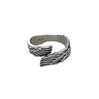 Close-up detail of the vintage silver couple ring emphasizing the angel wings design.
