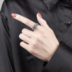 Silver couple ring with angel wings design in a lifestyle setting, showcasing elegant vintage style.
