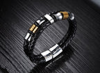 Close-up detail of the black leather hand chain highlighting its geometric design with a magnetic buckle.