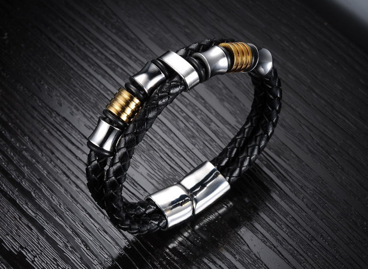 Close-up detail of the black leather hand chain highlighting its geometric design with a magnetic buckle.
