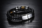 Close-up of the geometric leather bracelet with a smooth finish in black and gold.