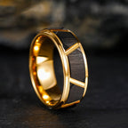 Close-up detail of the black tungsten gold ring, showcasing shiny finish and gold accents.