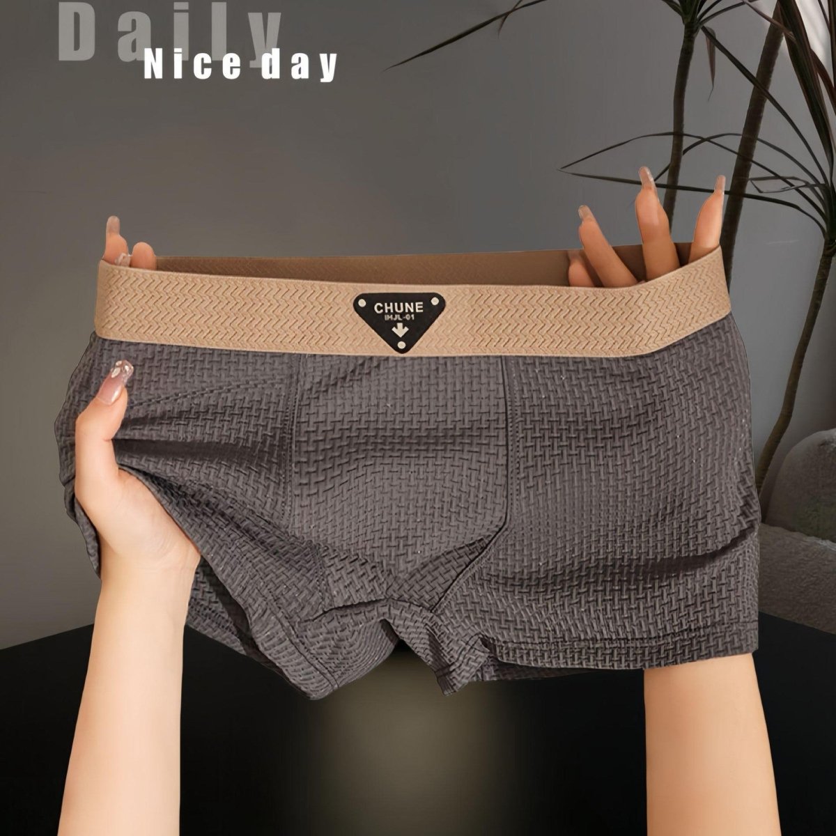 Lifestyle view of gray boxer briefs, featuring soft fabric and an elastic waistband for a chic look.