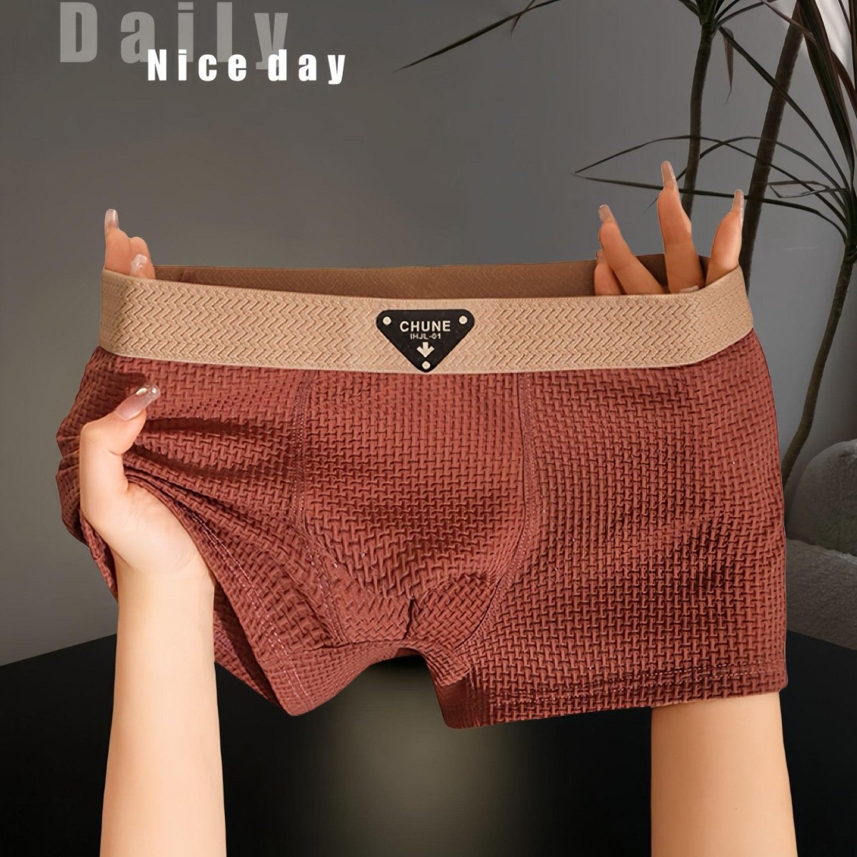 Detail shot of brown boxer briefs with elastic waistband, emphasizing soft fabric and comfort.
