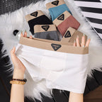 Lifestyle shot of white boxer briefs in soft fabric, showcasing a comfortable fit and various colors.
