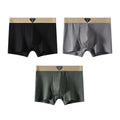 Packaging shot of boxer briefs assortment in black, blue, and gray, emphasizing variety and soft material.