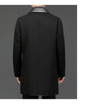 Back view of a black woolen coat with lapel collar, mid-length design in studio environment.