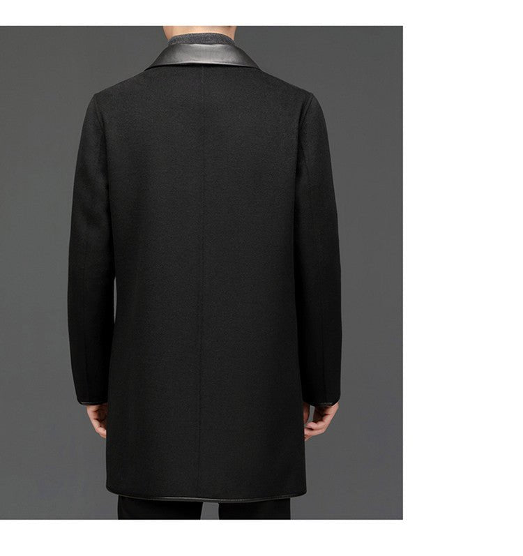 Back view of a black woolen coat with lapel collar, mid-length design in studio environment.