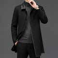 Lifestyle shot of a black woolen coat with lapel collar, mid-length, cashmere blend fabric in studio setting.