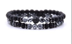 Detail close-up of black beaded bracelet with silver micro-inlaid zircon.