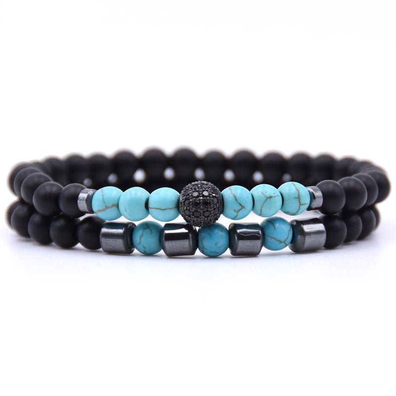 Detail close-up of multicolor beaded bracelet featuring turquoise and silver stones.