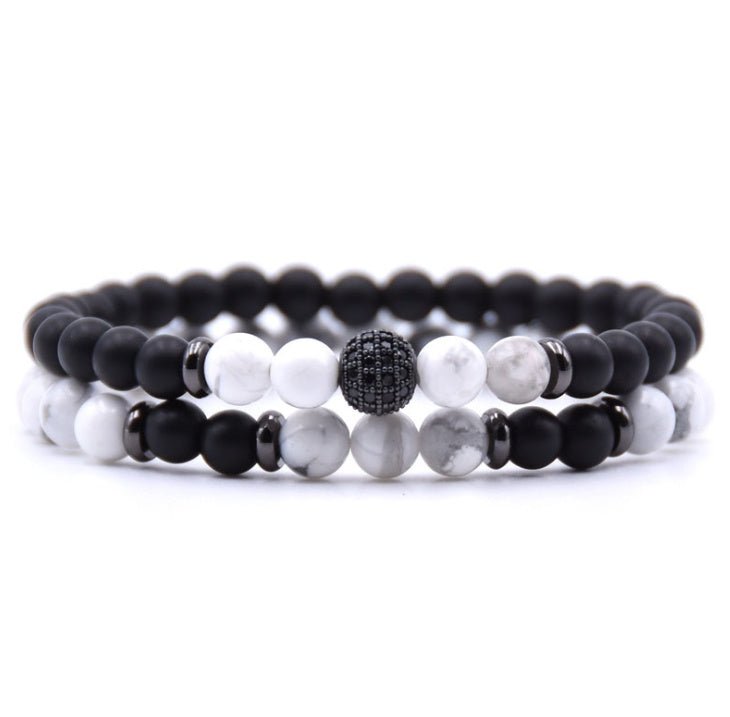 Detail close-up of black and white beaded bracelet with silver micro-inlaid zircon.