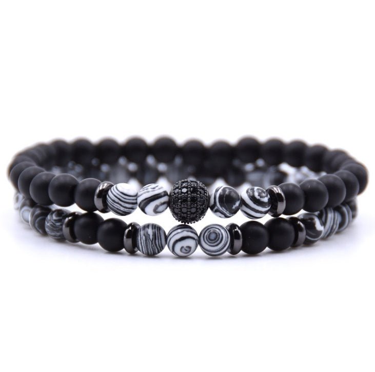 Detail close-up of black and gray beaded bracelet with silver micro-inlaid zircon.
