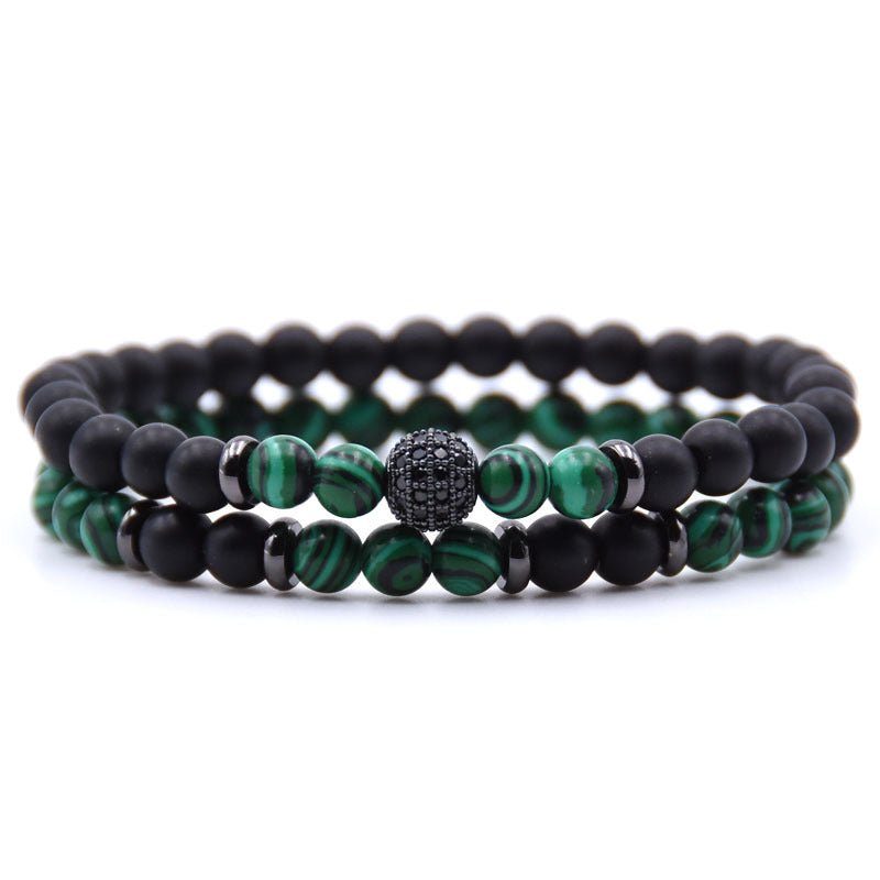 Detail close-up of green and black natural stone beaded bracelet with micro-inlaid zircon, stylish addition to a capsule w…