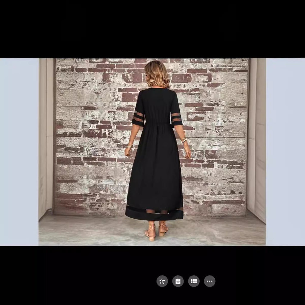 Back view of the black fishtail dress highlighting half sleeves and elegant design.
