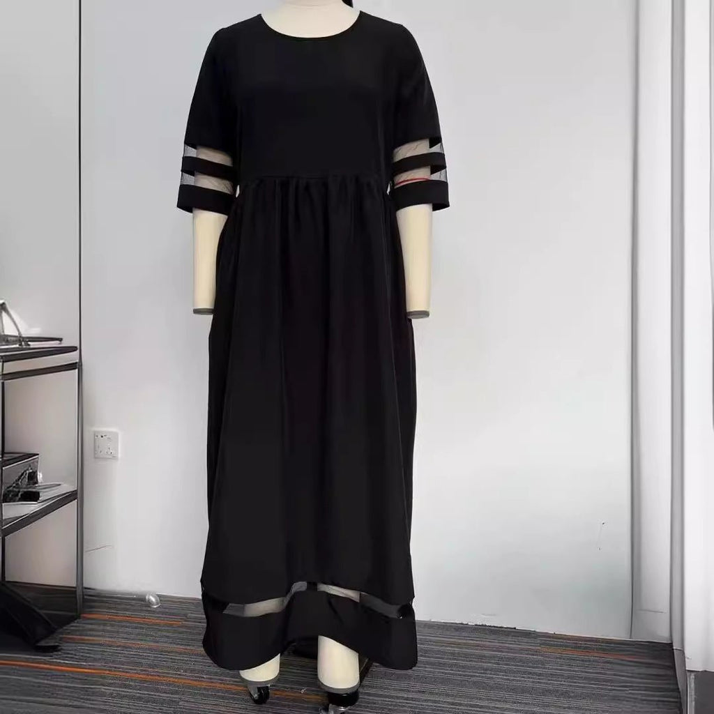 Back view of the black fishtail dress with half sleeves, emphasizing its stylish silhouette.