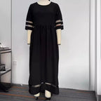 Back view of the black fishtail dress with half sleeves, emphasizing its stylish silhouette.