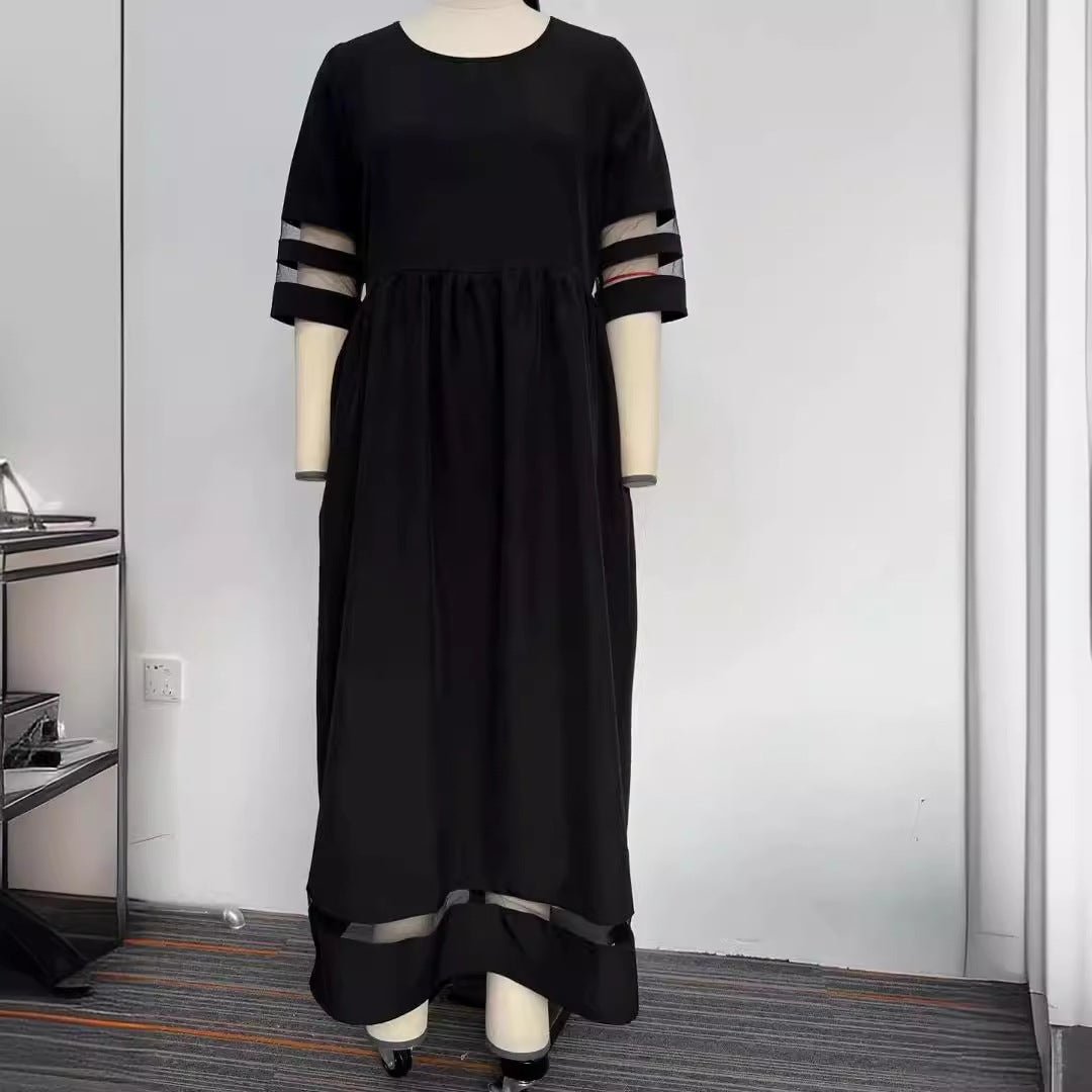 Back view of the black fishtail dress with half sleeves, emphasizing its stylish silhouette.