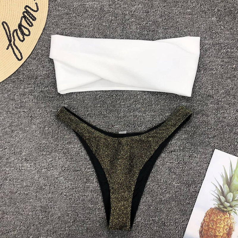 Detail close-up of black bikini set highlighting off-shoulder design, emphasizing minimalist style.