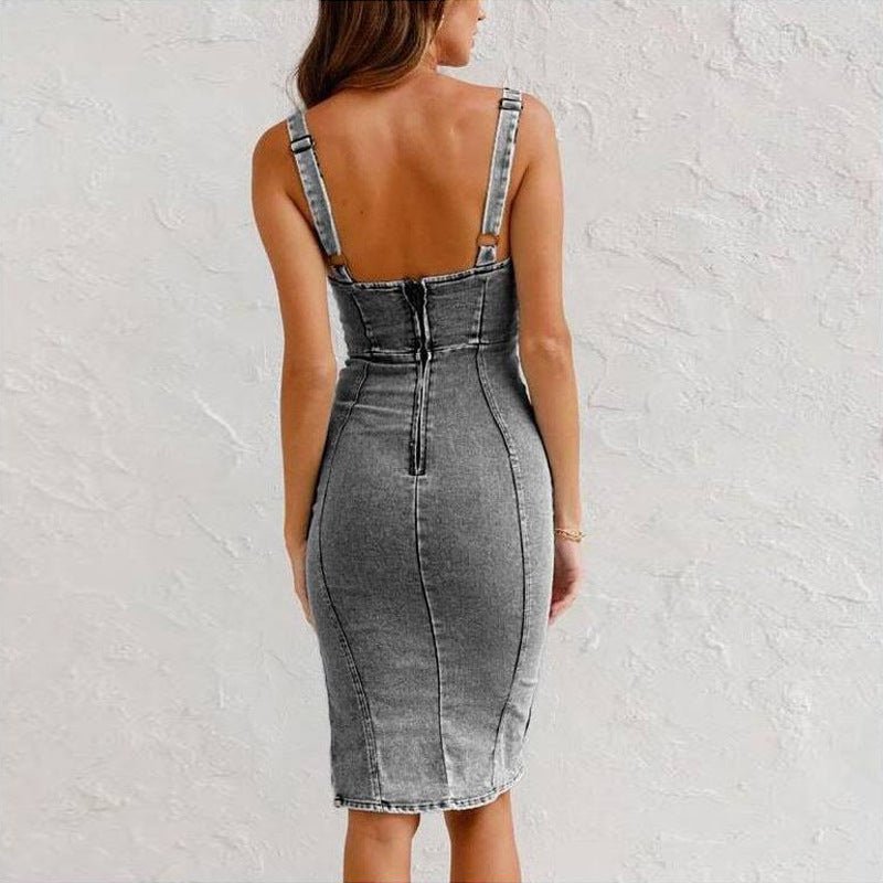 Back view of the denim suspender dress featuring button detail and adjustable straps in black and gray shades.