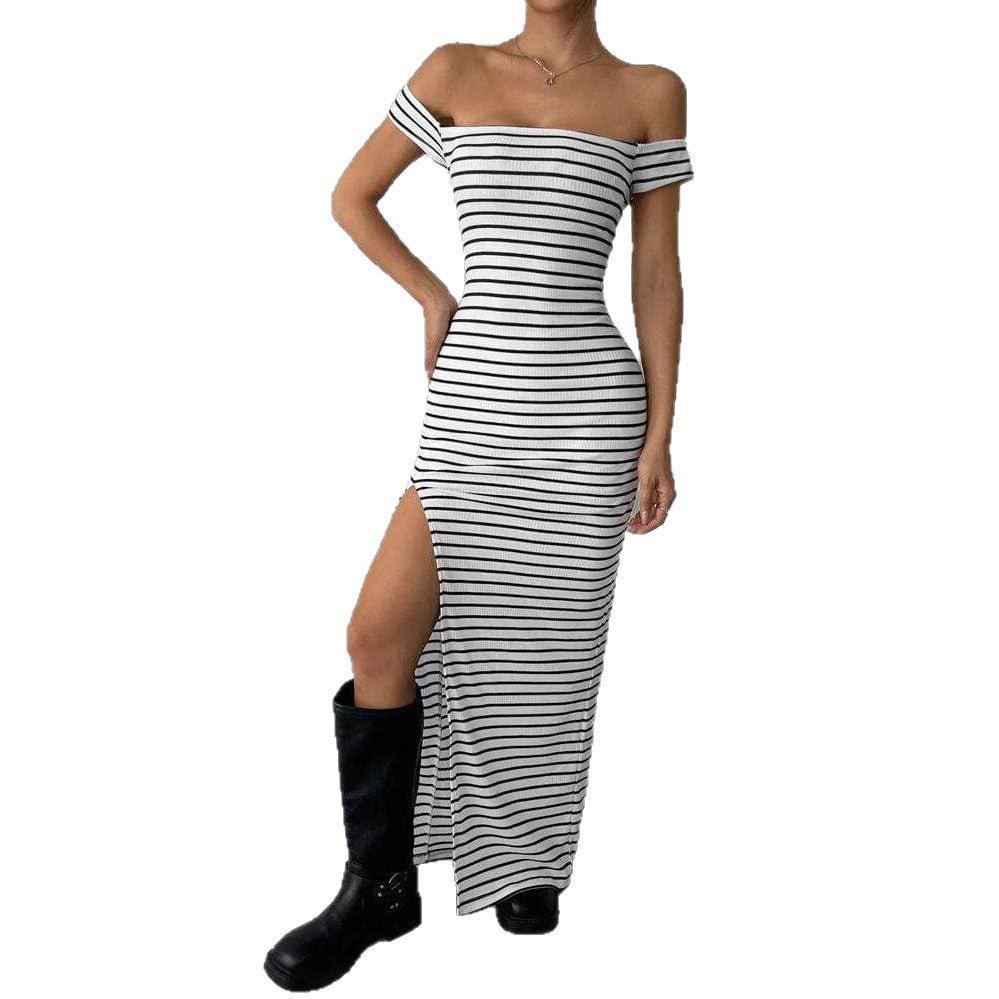 Detail close-up of the off-shoulder striped dress in black and white, highlighting the fabric and cut.