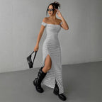 Lifestyle view of an off-shoulder striped dress in black and white, showcasing its elegant silhouette.