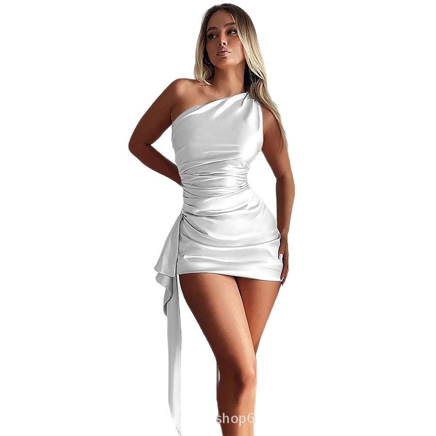 Lifestyle shot of a white one-shoulder mini dress, backless and sleeveless, showcasing chic fashion.