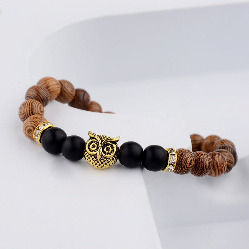 Detail close-up of the exotic wood grain bracelet featuring gold alloy stone accents, perfect for chic outfits.