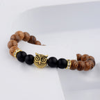 Detail close-up of the exotic wood grain bracelet featuring gold alloy stone accents, perfect for chic outfits.