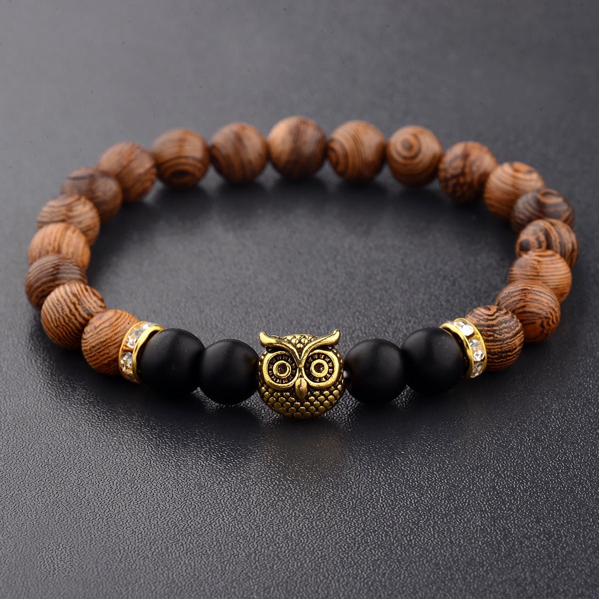 Detail close-up of the exotic wood grain bracelet featuring gold alloy stone accents on a studio background, perfect for s…