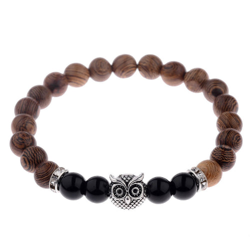 Detail close-up of the exotic wood grain bracelet with silver alloy stone accents, showcasing chic design.