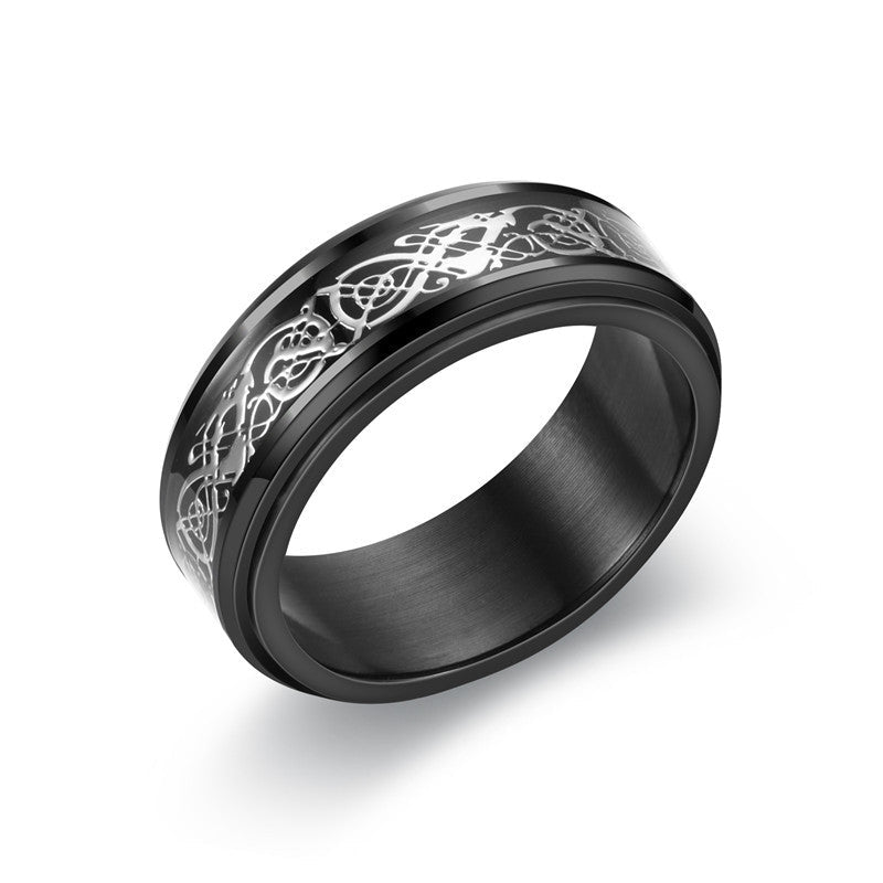 Detail close-up of a black and blue ring with gem accents and wide band.