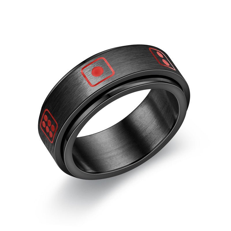 Detail close-up of a black ring with red square designs and a smooth finish.
