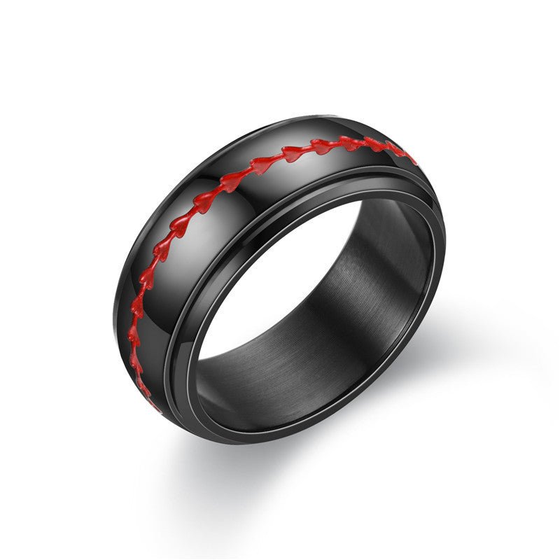 Detail close-up of a black ring with red stitching, showcasing a smooth finish.