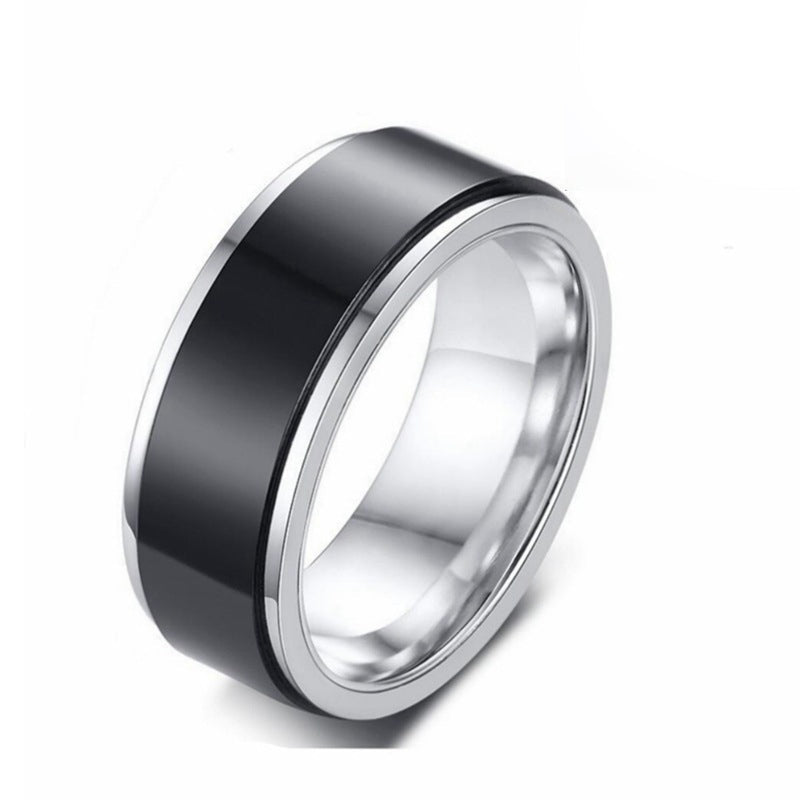 Detail close-up of a black titanium ring featuring a smooth finish and wide band.