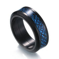 Detail close-up of a blue patterned titanium steel ring featuring a wide band design.