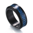 Detail close-up of a blue patterned titanium steel ring featuring a wide band design.