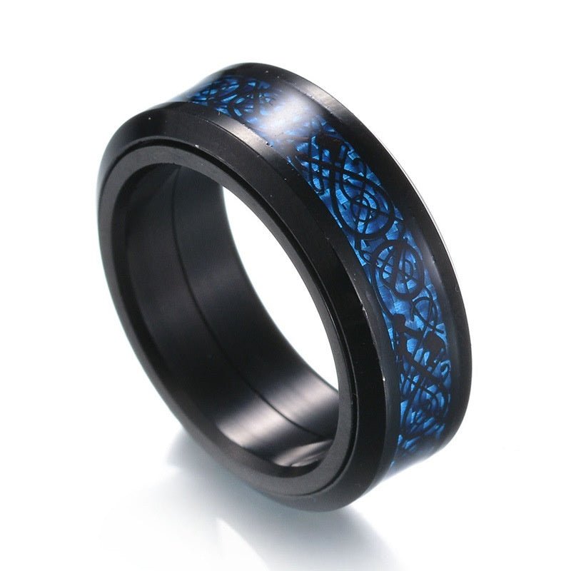 Detail close-up of a blue patterned titanium steel ring featuring a wide band design.
